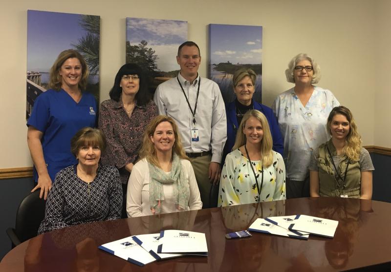 Summit Orthopaedic Home Care staff shown are in back (l-r) Leigh Ann Burke, registered nurse; Beth Hall, office manager; Eric Reinhold, owner; Jan Frank, clinical director; and Wanda Whitman, registered nurse. In front are Cathy Walls, office staff; Mary Teletchea, physical therapist; Sarah Reinhold, physical therapist; and Danielle Wagamon, physical therapist. SUBMITTED PHOTO